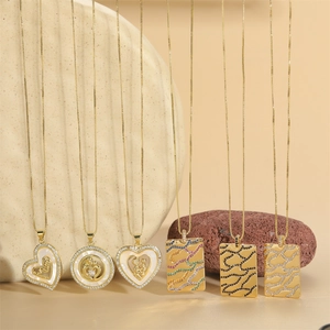Gold MOM letter necklace with heart and round pendants featuring zircon and mother of pearl