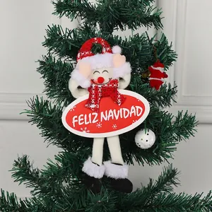 Christmas snowman decoration with Feliz Navidad sign hanging on green tree branch 25cm