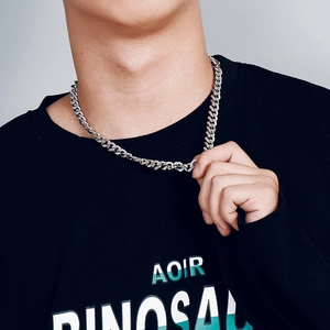 Male model wearing silver cuban link chain necklace in polished stainless steel