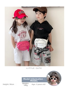 Detail of pink and silver faux leather waist bags on children in casual outdoor outfits