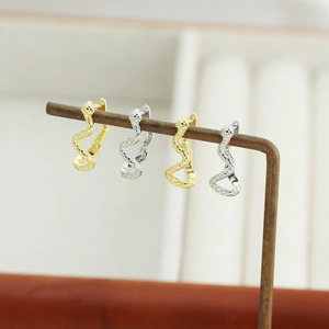 S925 sterling silver snake earrings in gold and silver finish with detailed scale texture