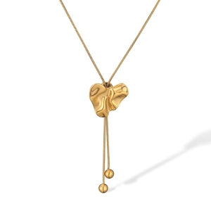 Detail of 18K gold-plated heart geometric pendant necklace with hammered texture finish