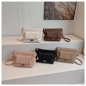 Detailed display of vintage corduroy shoulder bags with stylish metal twist locks