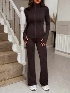 Deep brown Y2K tracksuit featuring a slim fit zip-up top with thumbholes and flared yoga pants