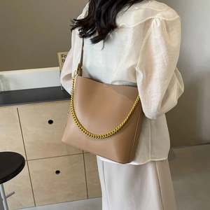 Minimalist khaki leather tote bag with gold chain strap for stylish office commuting