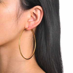 Polished 18k gold plated stainless steel geometric hoop earrings for women on model
