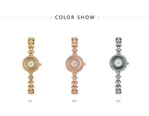 Close-up of gold, rose gold and silver quartz watches with rhinestone crystals