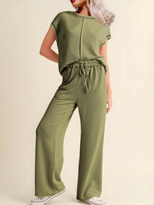 Women's green two-piece lounge set with short sleeve top and drawstring wide leg trousers