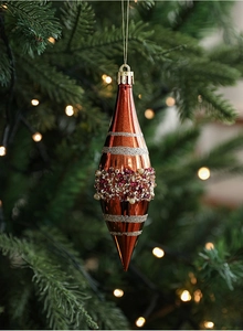 Detailed view of bronze Christmas teardrop ornament with glitter bands and sequins