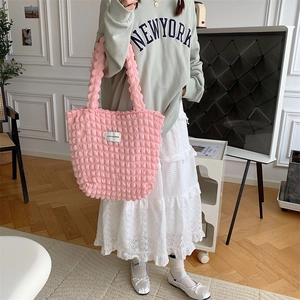 Pink bubble texture tote bag showing soft fabric details and minimalist floral pattern