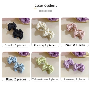 Close-up of elegant satin bow hair claws in six soft pastel colors for styling