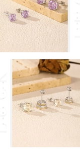 Gros plan de boucles d'oreilles en argent S925 avec zircons lavande et champagne