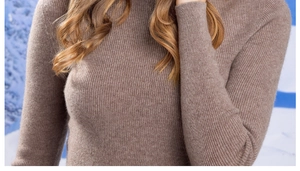 Detailed close-up of taupe ribbed knit fabric and texture on a warm winter turtleneck sweater