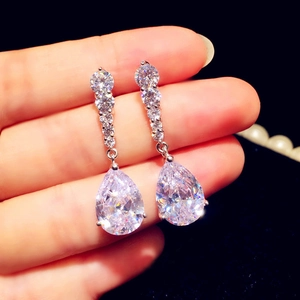 Elegant silver-toned long drop earrings featuring sparkling pear-cut cubic zirconia stones
