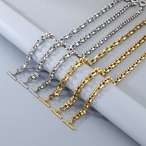 Detail of silver and gold stainless steel bamboo link bracelets with OT toggle clasps