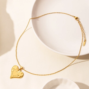 Detail of 18k gold plated heart pendant necklace with adjustable fine chain link