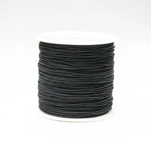 Detailed view of 0.8mm black braided cord roll for DIY jewelry making and knots