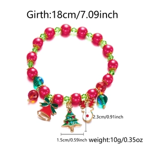 Close-up of Christmas charm bracelet with Santa, bell and wreath enamel pendants