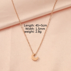 Detail view of rose gold crescent moon pendant necklace with size and weight dimensions