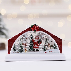 Light-up Christmas snow globe lantern with Santa, reindeer and swirling glitter