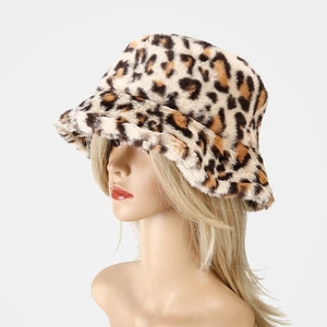 Close-up of plush leopard print faux fur texture on a warm winter bucket hat