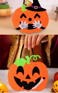 Felt Halloween pumpkin treat bags with Happy Halloween text and black handles