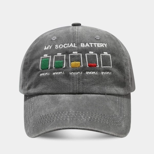 Close-up of MY SOCIAL BATTERY embroidery on a vintage washed grey cotton baseball cap