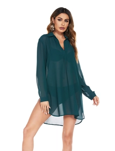 Detail of dark green semi-transparent chiffon cover-up with V-neck and side slits