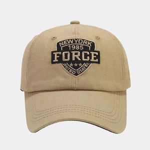 Detailed close-up of khaki cotton baseball cap with vintage American embroidery art