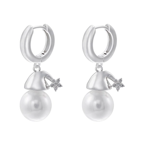 Detail of silver Santa hat earring with star zircon and a white pearl on white background