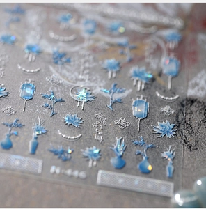 Macro view of Chinese style nail art stickers with blue lotus and calligraphy motifs
