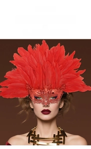 Detail of red electroplated fox mask with large feathers and hollow-out craftsmanship