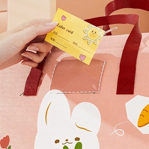 Pink cartoon rabbit quilt storage bag with a transparent name tag card for school kids
