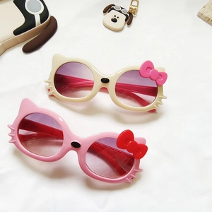 Cute cat-shaped kids sunglasses with bow detail and gradient lenses on a white background