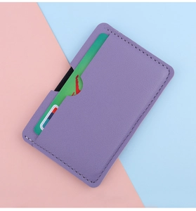 Detail of purple lychee pattern leather card holder with card inserted and fine stitching