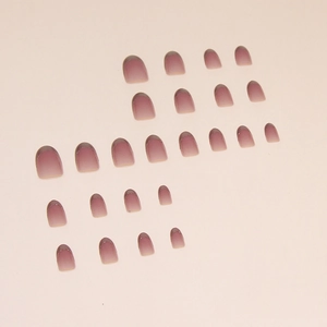 Pink gradient cat-eye press-on nails with silver French tips in a short round shape