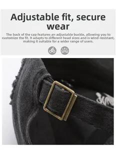 Detail of adjustable metal buckle and frayed cotton strap on a black baseball cap