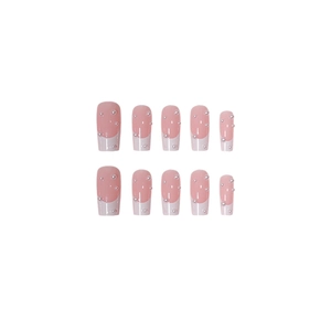 Long trapezoid French press-on nails set with pink base, white tips and pearl accents