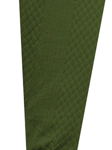 Detail of dark green knit fabric with intricate jacquard herringbone and diamond patterns
