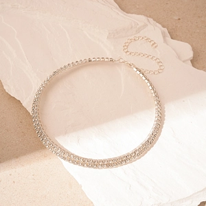 Close-up of double-row rhinestone choker necklace with adjustable silver metal chain