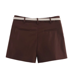 Detail view of dark brown shorts back with white belt and decorative pockets
