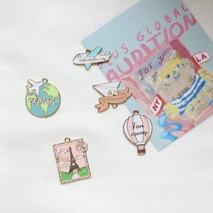 Travel themed enamel charms set with airplane hot air balloon and Eiffel Tower stamp