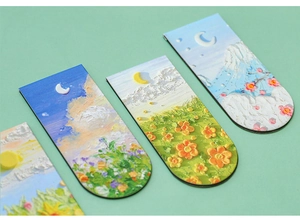 Detail showing oil painting texture and embossed floral landscapes on magnetic bookmarks