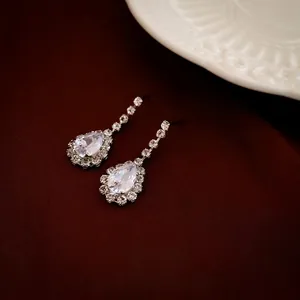 Exquisite silver-tone teardrop V-shape necklace with sparkling diamond-set zirconia stones
