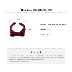 Detailed product specifications for the red flocked bow open ring with size and materials