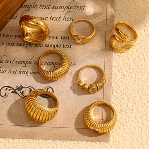 Close-up of 18K gold plated stainless steel ring set with hammered texture and zircon detail