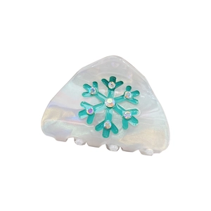 Triangle pearl white hair claw with turquoise snowflake and rhinestones on white background