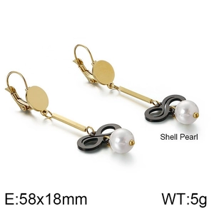Detail view of long pearl bow earrings showing 58x18mm size and shell pearl texture