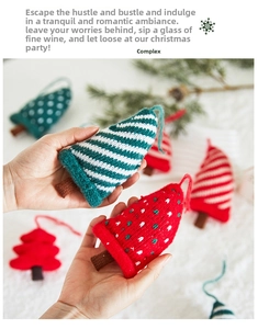 Close-up of knitted Christmas tree ornaments with colorful stripes and hanging ropes