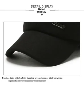 Detail of durable black baseball cap with structured brim and JEANS embroidery